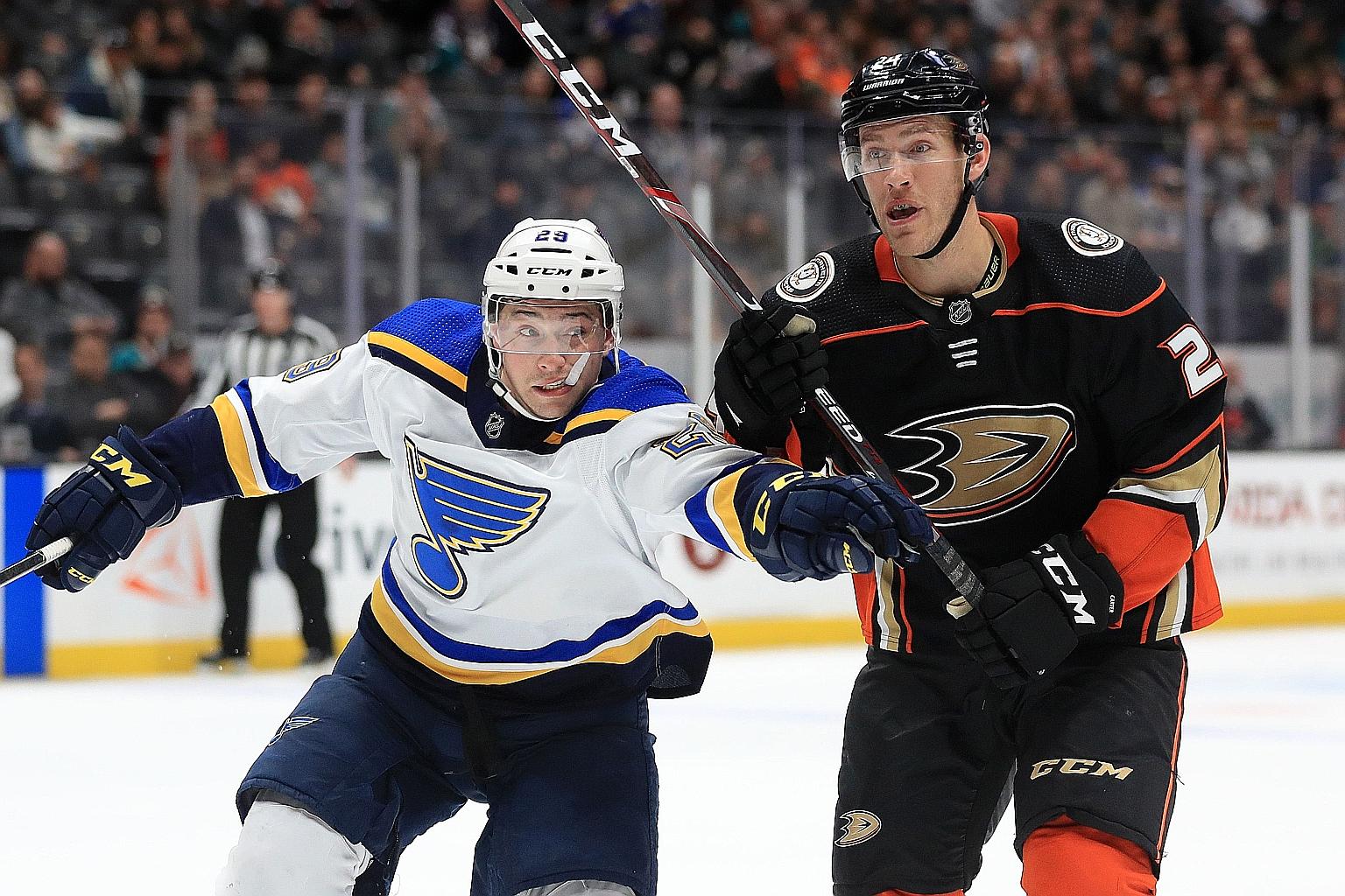 St Louis Blues' Vince Dunn taking on Ducks forward Carter Rowney in Anaheim, California on March 11, a day before the NHL season was put on ice.