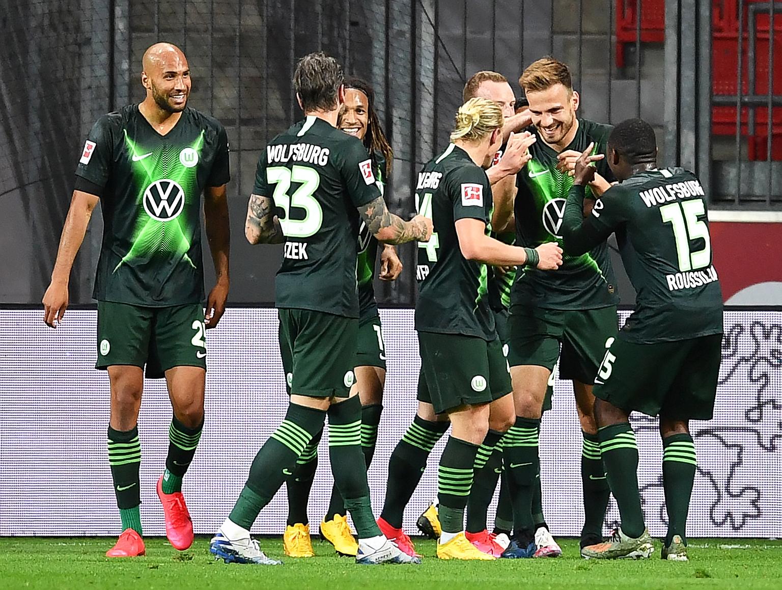Marin Pongracic (second from right) is surrounded by teammates after putting Wolfsburg 4-0 up with his second goal against Leverkusen.