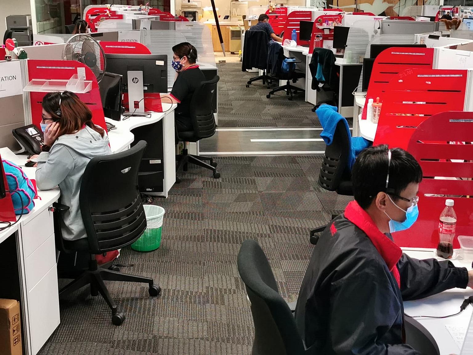 Customer care officers at Singtel. The telco is looking to fill around 2,000 jobs to meet needs in areas such as 5G, cloud and the Internet of Things.