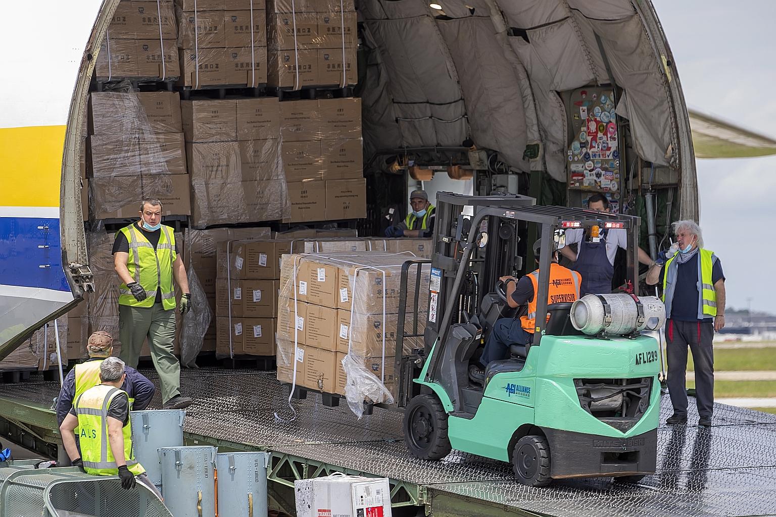 Workers at the Hartsfield-Jackson Atlanta International Airport in Georgia unloading face masks from China this month. Washington has been increasingly concerned about the growing reliance of the US on foreign - particularly Chinese - pharmaceutical