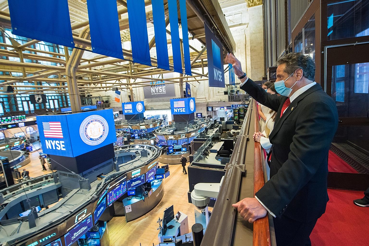 New York Governor Andrew Cuomo ringing the opening bell at the New York Stock Exchange on Tuesday as the building opens for the first time since March.