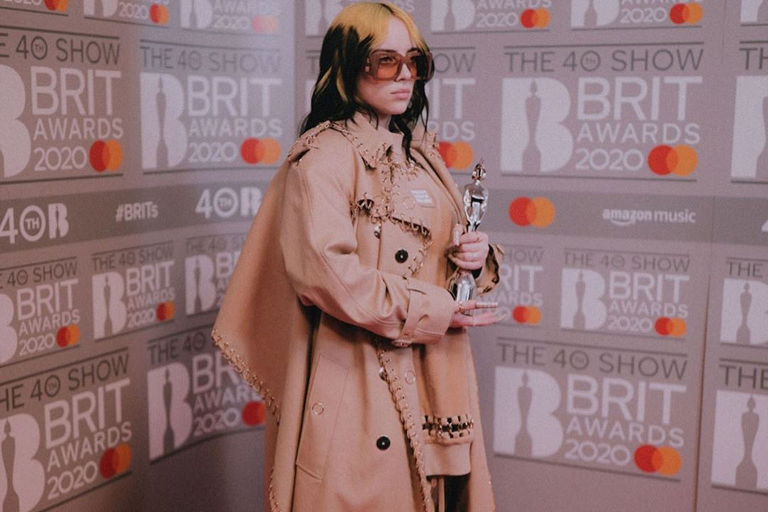 American singer Billie Eilish (above) has received praise and criticism for her fashion choices.