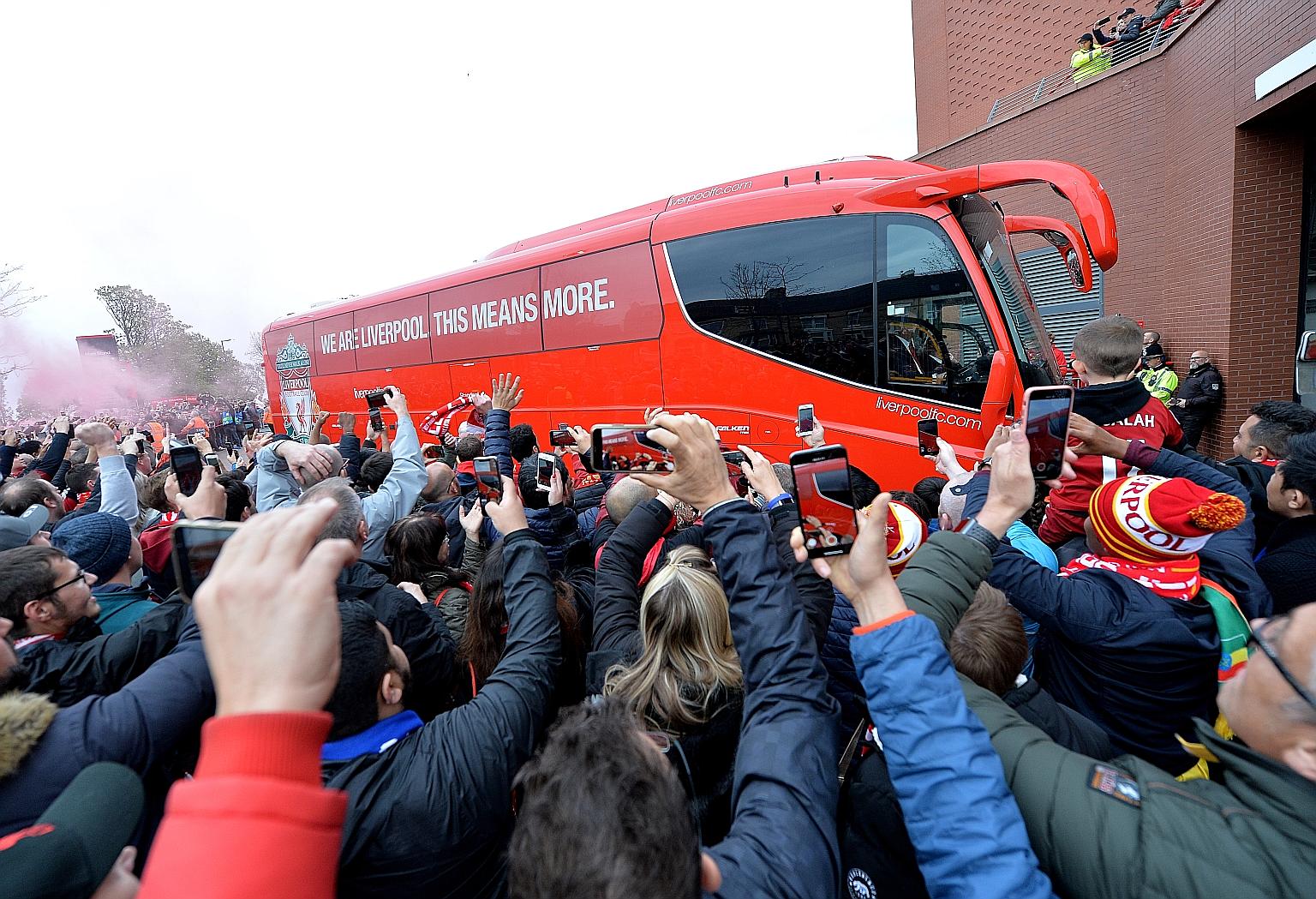Liverpool fans greeting the team bus at Anfield for the Champions League match against Barcelona last year. British Police are worried about fans gathering outside the stadium for Reds games when the Premier League restarts.
