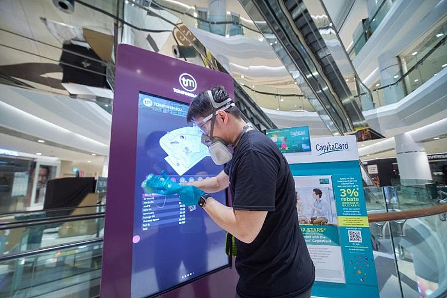 High-contact areas in CapitaLand malls, including Tampines Mall (above), will progressively be coated with an anti-microbial disinfectant. 