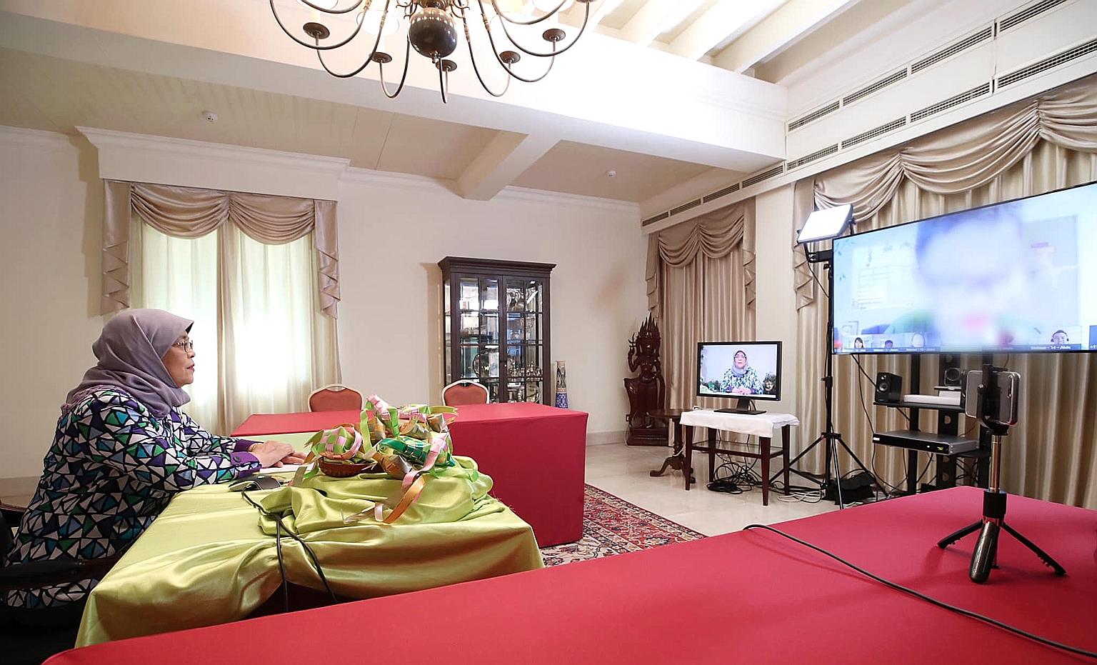 President Halimah Yacob speaking with residents of Melrose Home - which houses vulnerable children and youth aged between six and 21 - via teleconferencing from the Istana yesterday. Some told her that they missed their friends and teachers in school