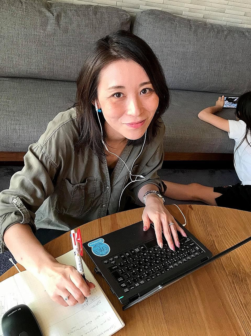 Ms Yayoi Yakumo says she relishes being able to spend more time with her family while working from home, though "it has taken some getting used to in order to keep my work and personal lives separate". 