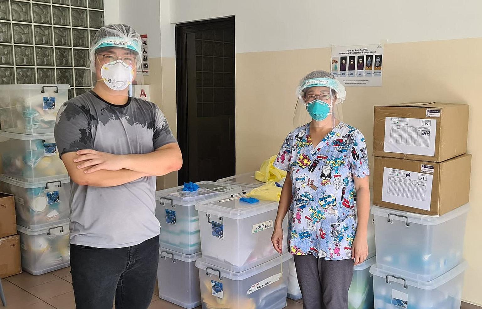 Volunteer "swabber" Elmer Chan (left), who graduated last month with a diploma in aviation management and services, with Dr Lim Lii, who carries out swab tests and trains would-be "swabbers".