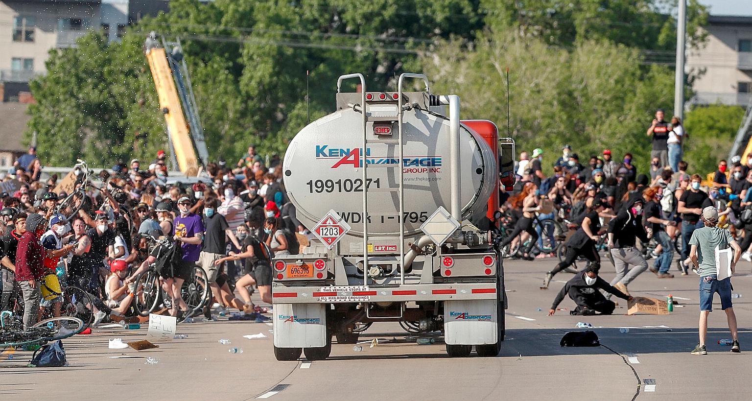 A truck being driven at high speed into a crowd of protesters marching on the 35W northbound highway in Minneapolis, Minnesota, on Sunday during a protest over the death of a black man, Mr George Floyd, while in police custody. According to media rep