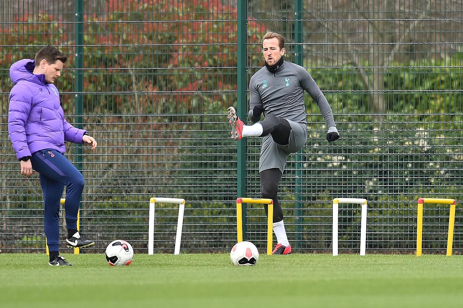 Harry Kane warming up during a Tottenham training session before the Premier League was suspended in March. The three-month hiatus has allowed the striker to recover from an operation on his hamstring and he is set to feature when action resumes this