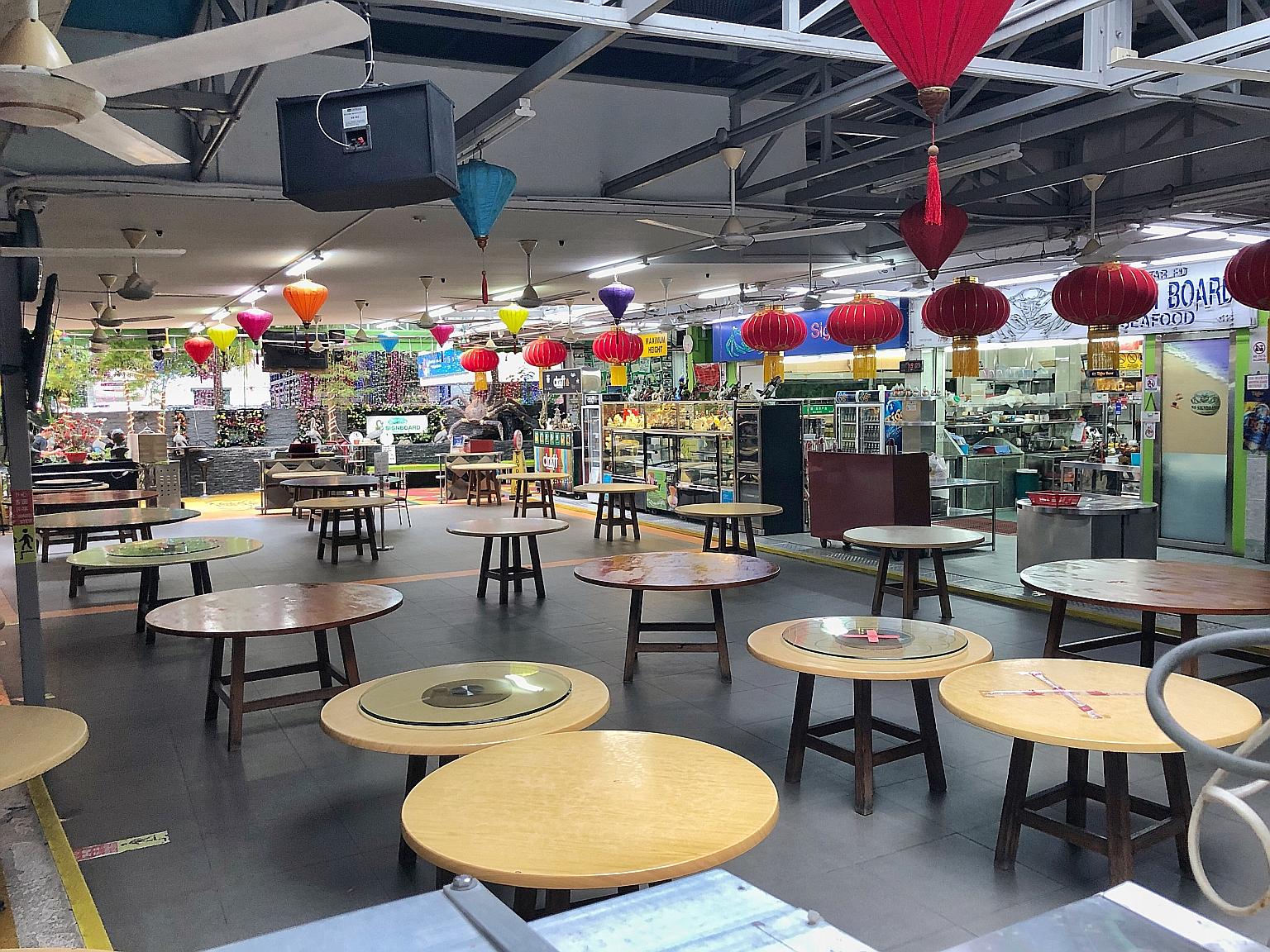 Empty tables at Mattar Road No Signboard Seafood Restaurant in Geylang Road last month. MP Lim Biow Chuan will ask the Government to consider letting F&B outlets open for dining in in the first phase.