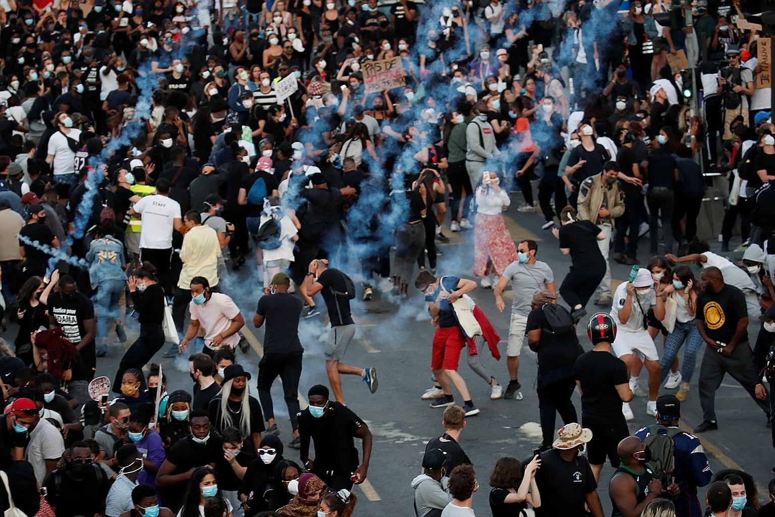 Clashes broke out between police and protesters in Paris on Tuesday after some 20,000 people rallied over the 2016 death of Mr Adama Traore, a black man, in police custody. Many were riled up by protests in the United States against police brutality