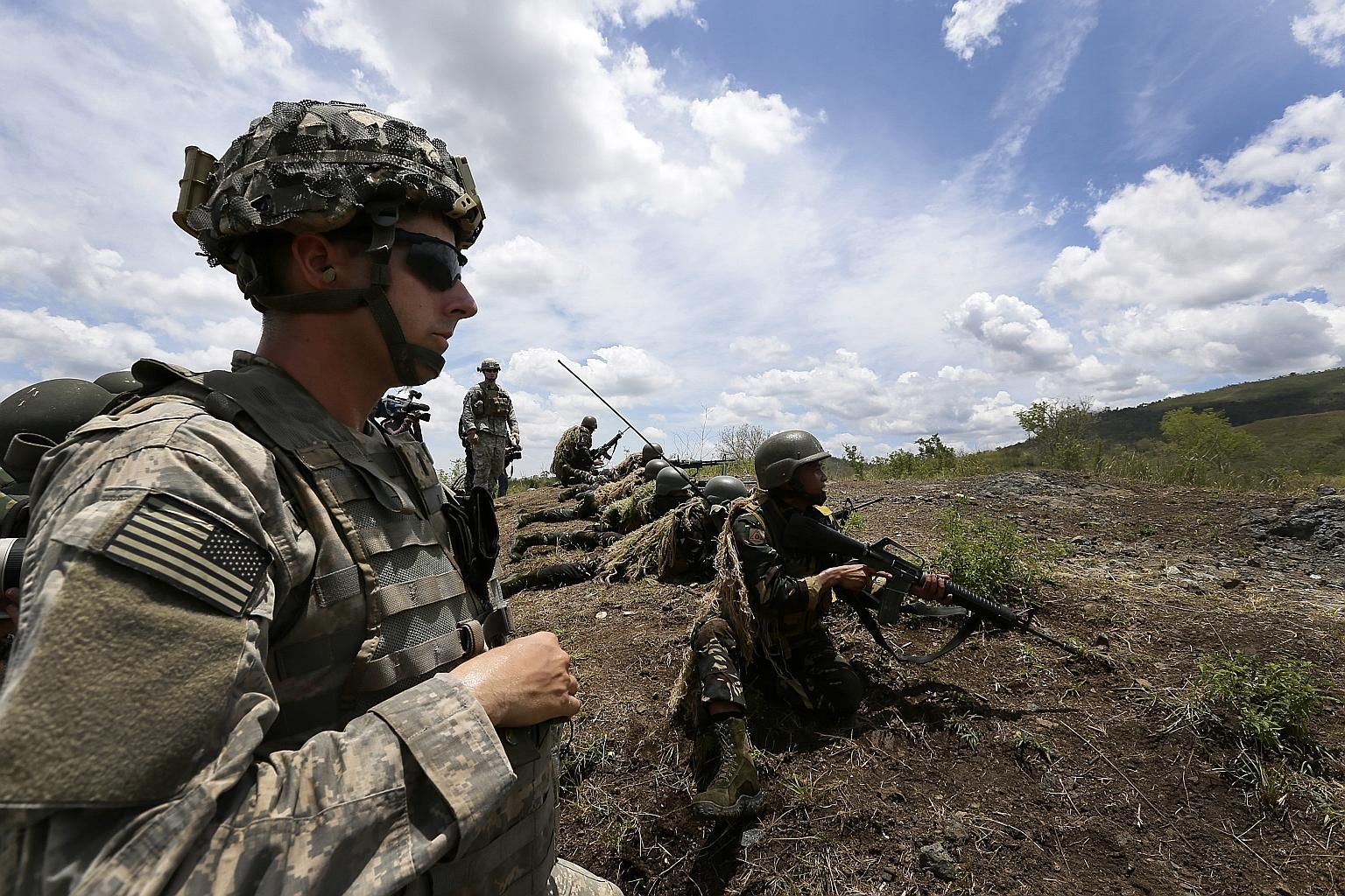 A joint military exercise between US and Philippine armed forces at Fort Magsaysay army training camp in Palayan City, north of Manila, in 2014. The Visiting Forces Agreement gives legal cover to thousands of US troops rotated to the Philippines for