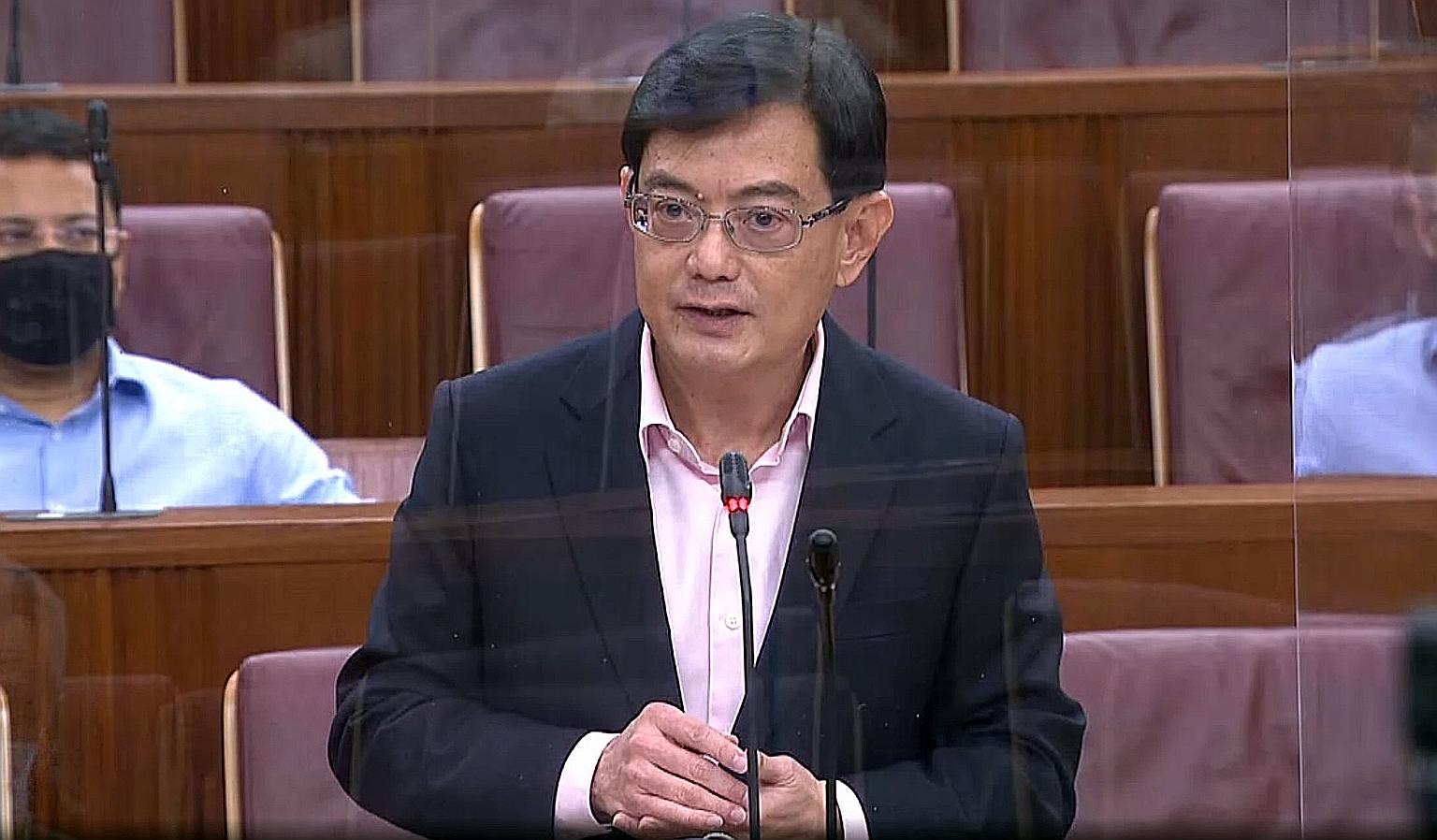 Deputy Prime Minister Heng Swee Keat speaking in Parliament yesterday. He said Singapore is not only armed with sizeable financial reserves that will help save many jobs, but it also has deep social reserves, mutual trust and close partnerships.