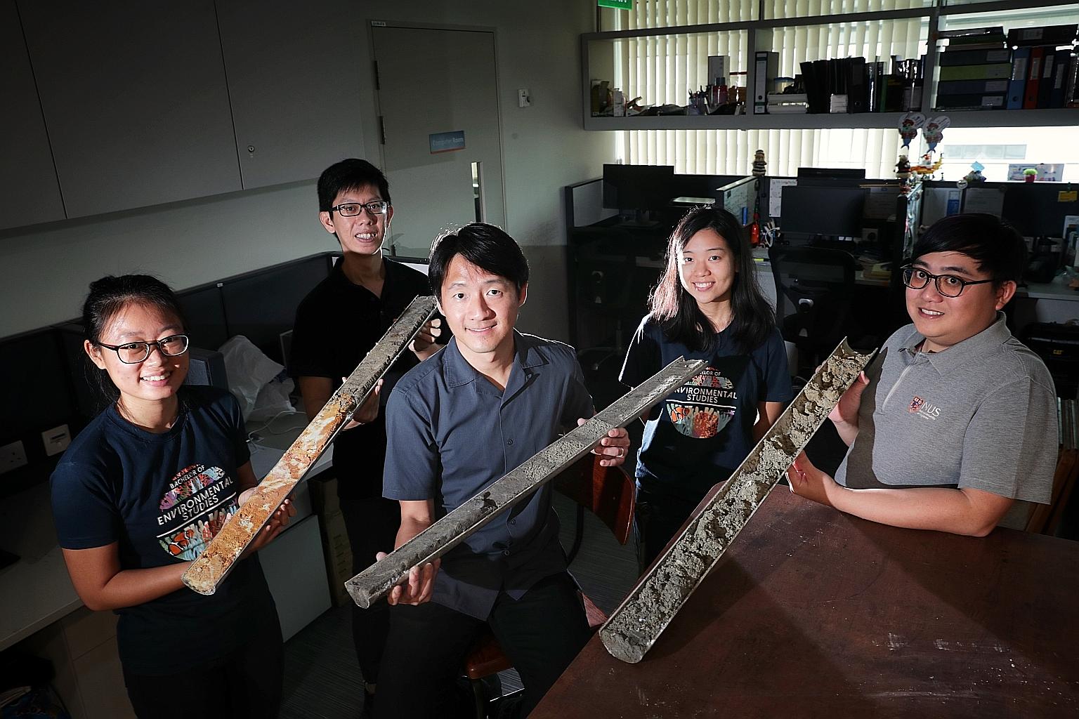 The study's principal investigator Huang Danwei (centre) and core members of his National University of Singapore team - (from left) research assistant Oh Ren Min, 24; PhD student Samuel Chan, 29; undergraduate Choo Min, 23; and research assistant Am