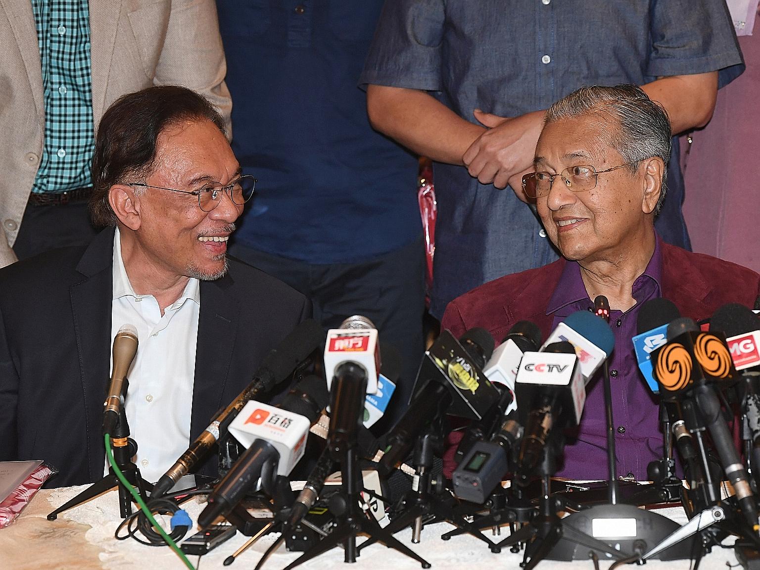 Datuk Seri Anwar Ibrahim with Tun Dr Mahathir Mohamad in a February photo. It is an open secret that both men believe they should be prime minister should the Muhyiddin administration fall, although publicly, neither is committing either way. Dr Maha