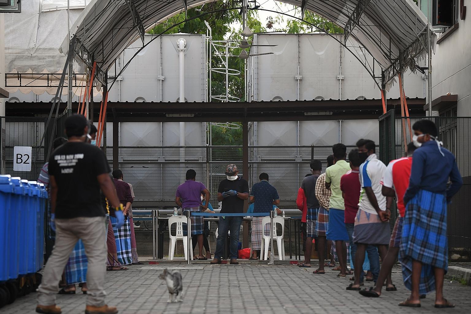 Migrant workers standing in line at a remittance facility at Avery Lodge dormitory. Such queues could be a thing of the past under a recently launched initiative by fintech firm Remsea, where workers can now send a portion of their salaries home with