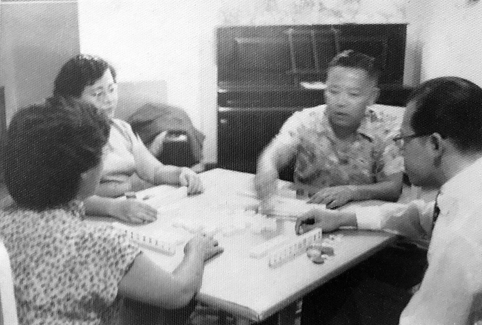The writer's grandfather (facing camera) and grandmother (back to camera) playing mahjong with their friends. These sessions would last till 2am.