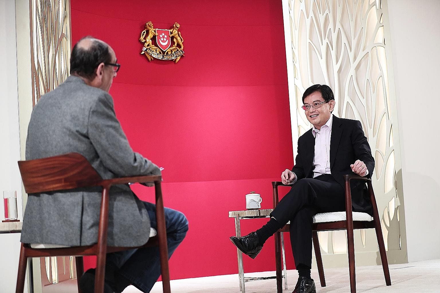 Deputy Prime Minister and Finance Minister Heng Swee Keat with Straits Times associate editor Vikram Khanna during the interview at Mr Heng's office at The Treasury yesterday. The Covid-19 pandemic has been a "sudden shock" to the system on many fron