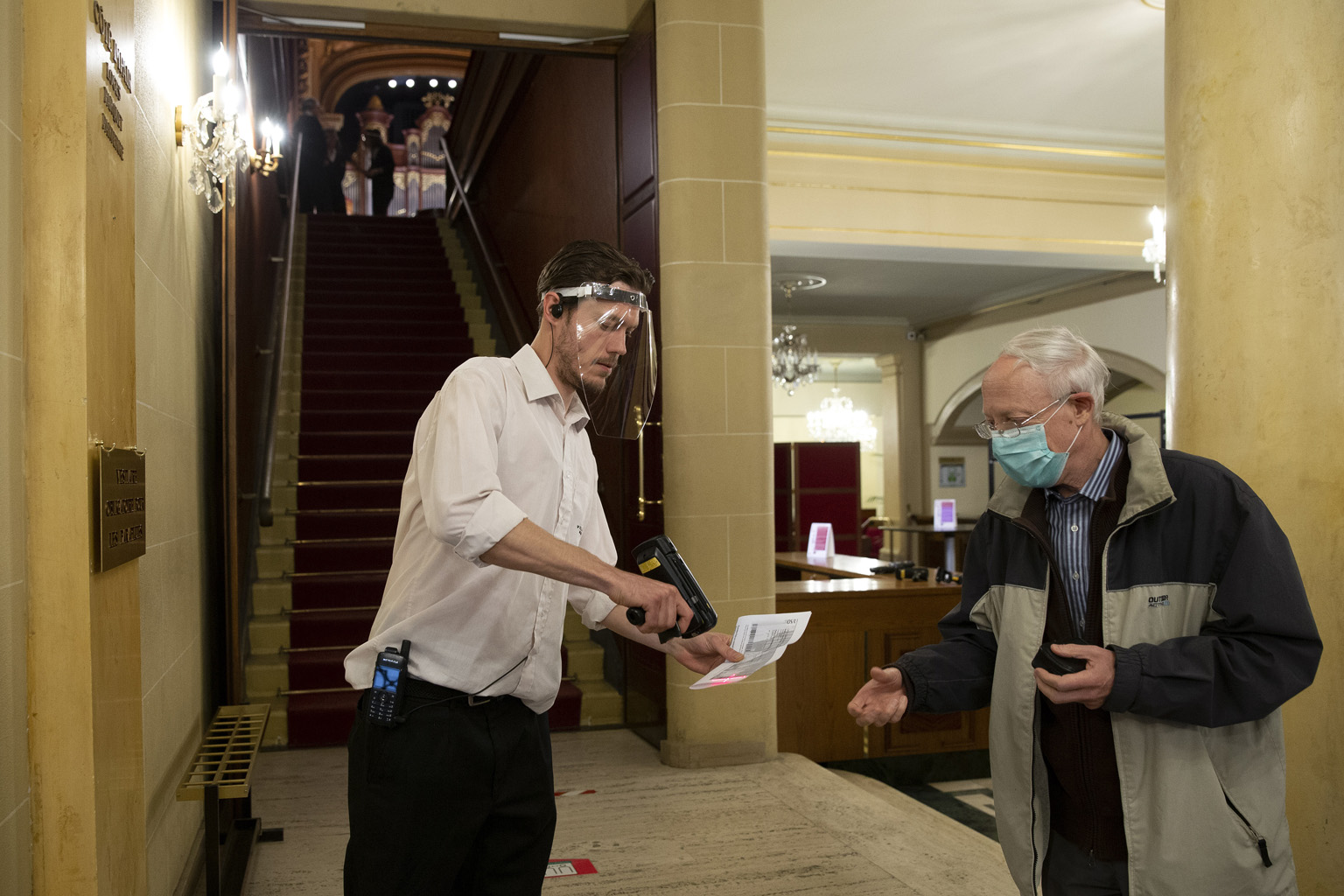 A staff member with a face shield scanning entry tickets to a concert in Geneva last Saturday. Switzerland tops the list of safest places to live in during the pandemic, followed by Germany.
