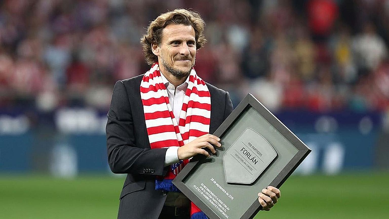 Diego Forlan believes that team managers must empathise with players who are concerned about the risks of catching Covid-19 when they return to action. Football jerseys decorate a shopping street in downtown Madrid on Monday. The Spanish La Liga resu