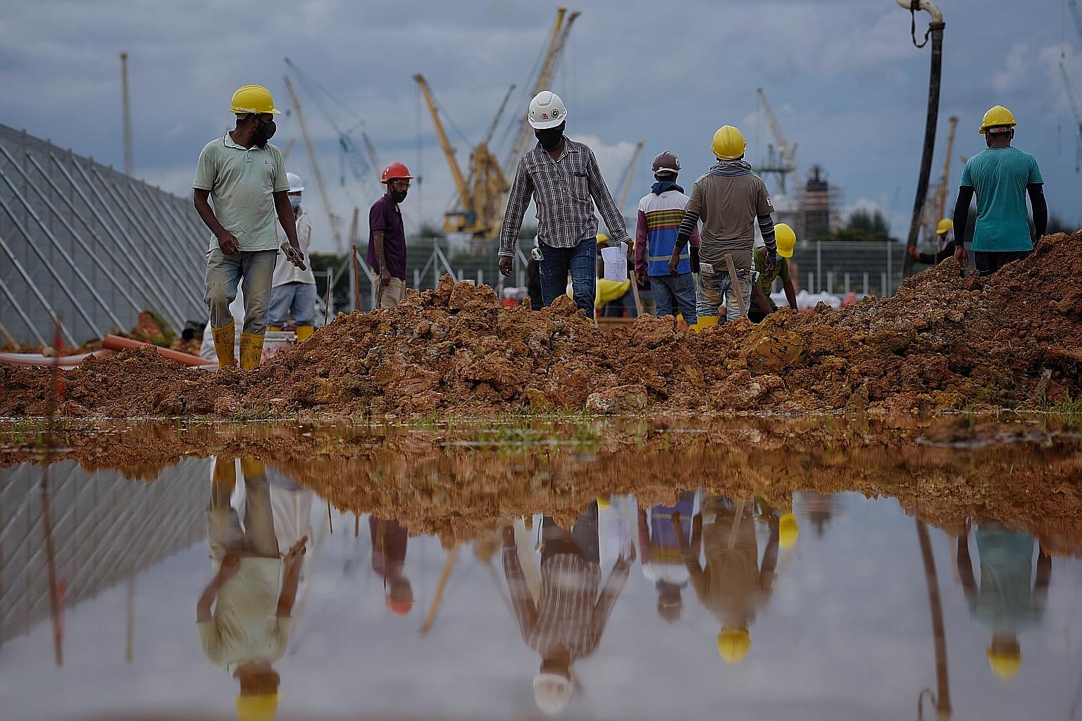 Foreign workers who have received approval to resume work will see a green AccessCode on their SGWorkpass app, provided their companies have been given approval to resume work as well. ST PHOTO: MARK CHEONG