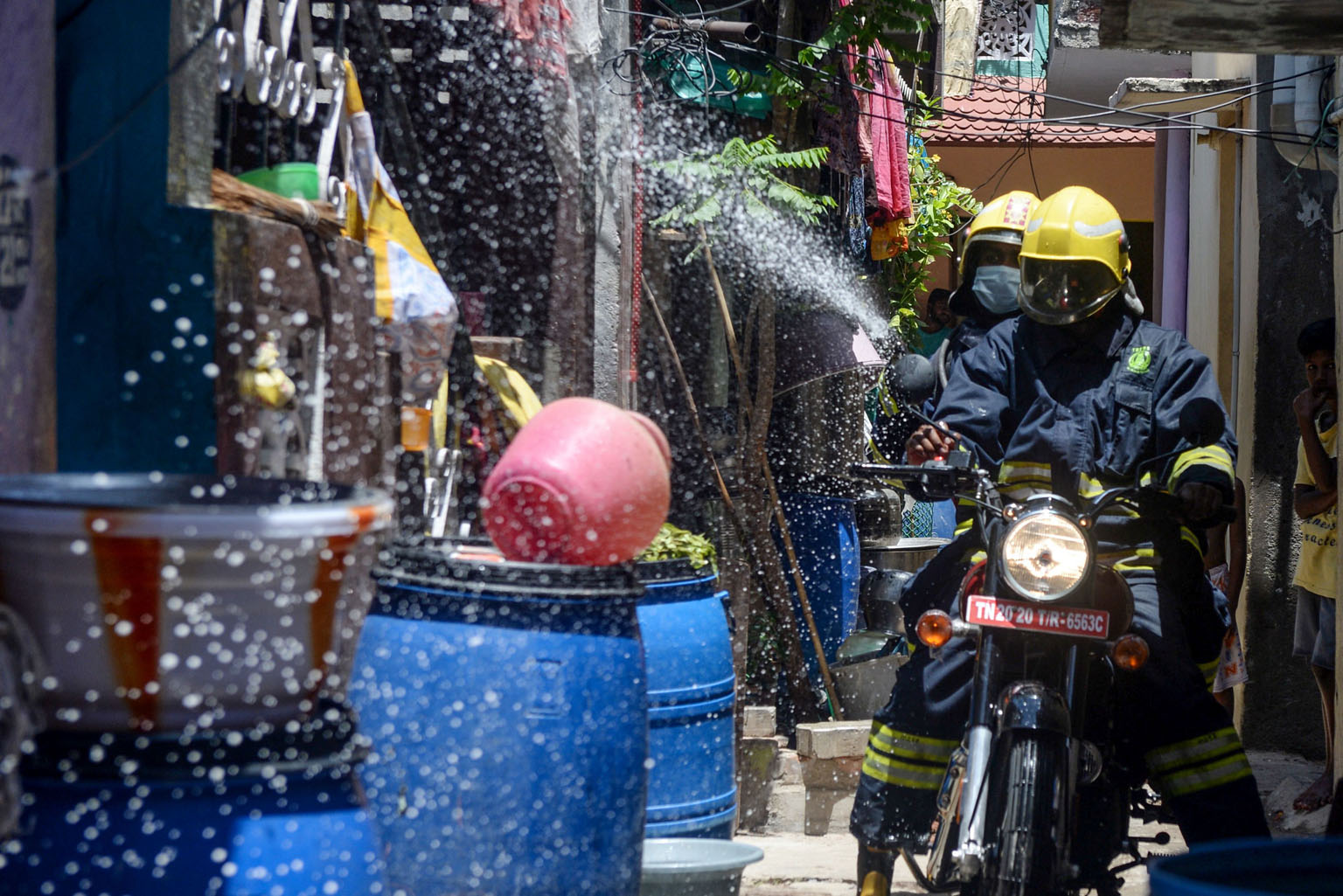 Firefighters on motorbikes spraying disinfectant in containment zones as a preventive measure against the spread of the coronavirus in Chennai, the capital of the Indian state of Tamil Nadu. PHOTO: AGENCE FRANCE-PRESSE
