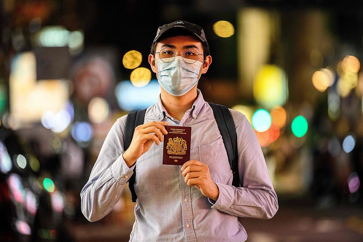 Tutor Reese Tan, 25, with his British National (Overseas) passport. It gives holders access to British consular services and permission to travel to the UK for up to six months at a time, but not to live or work there.