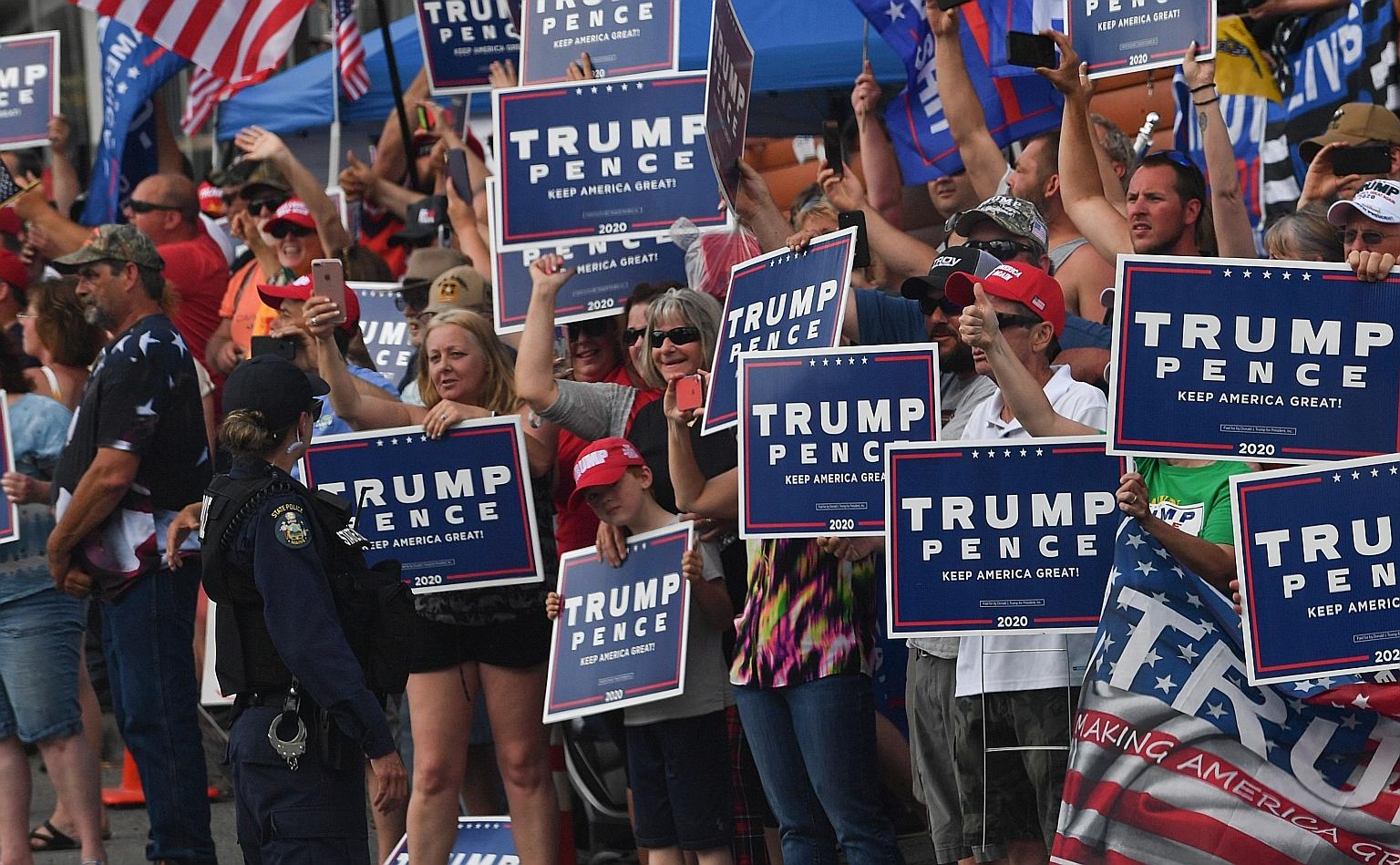 Supporters waiting for President Donald Trump during his recent visit to a medical products facility in Guilford, Maine. Those attending his upcoming election rally must sign a waiver on his campaign website agreeing not to sue if they catch Covid-19