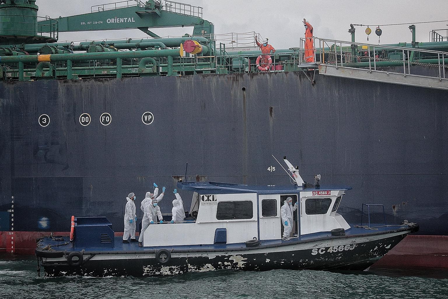 Crew members leaving oil tanker STI Carnaby for Marina South Pier yesterday morning after having sailed for months because of border closures over the Covid-19 outbreak. Later in the day, the crew left for home on a chartered flight to India. The Mar