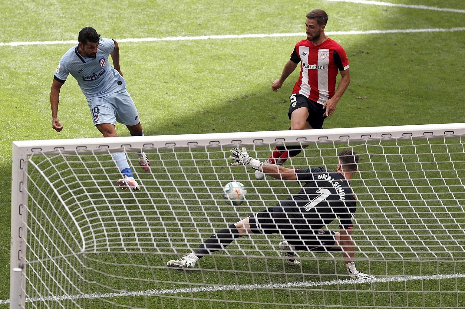Atletico Madrid forward Diego Costa scoring past Athletic Bilbao custodian Unai Simon for the equaliser in their La Liga game, his first goal since last October. Atletico stay sixth, behind fellow Madrid side Getafe on goal difference.