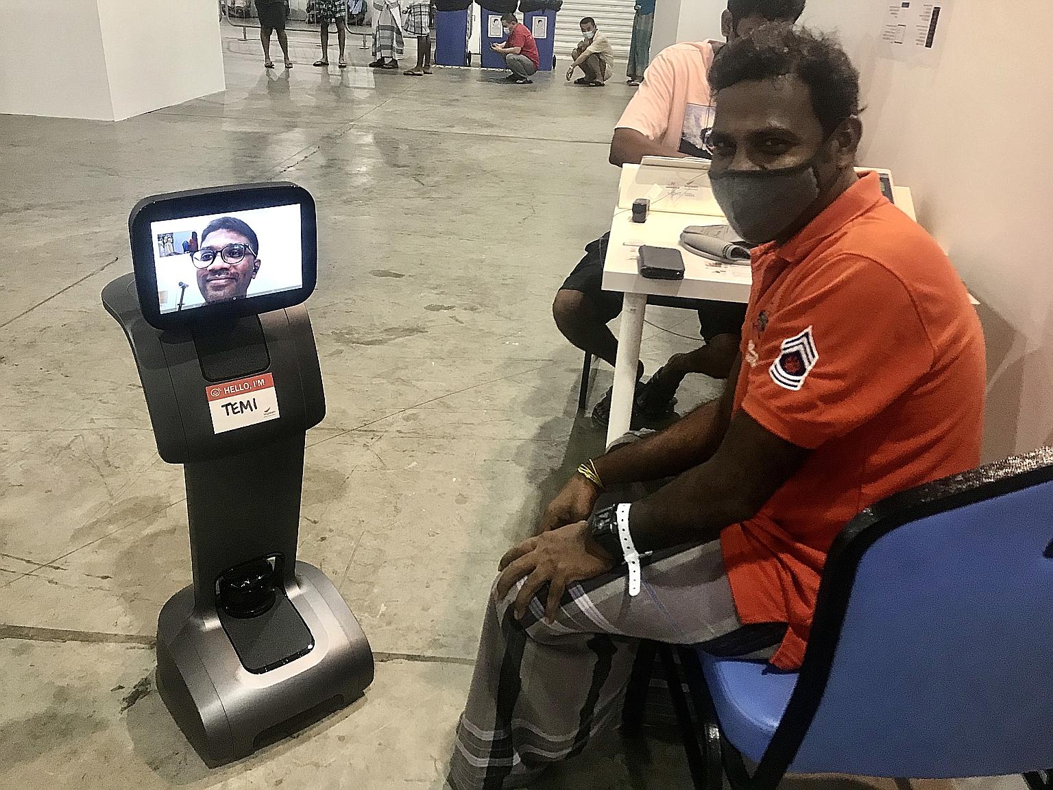 A patient at SingHealth's community care facility at the Singapore Expo having a teleconsultation via Temi, a remote-controlled robot. PHOTO: SINGHEALTH