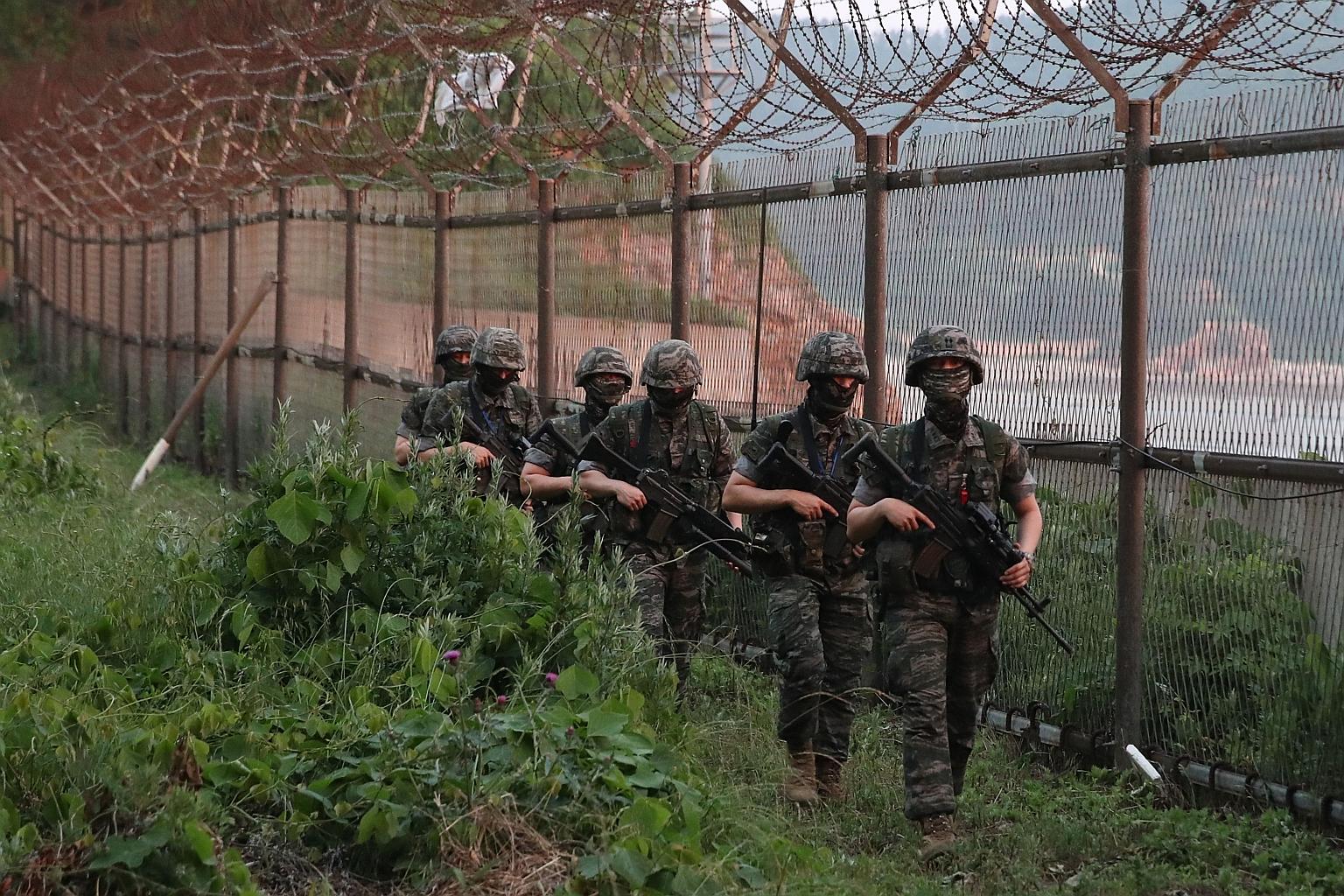 South Korean marines patrolling the South Korea-controlled island of Yeonpyeong near the Northern Limit Line yesterday.