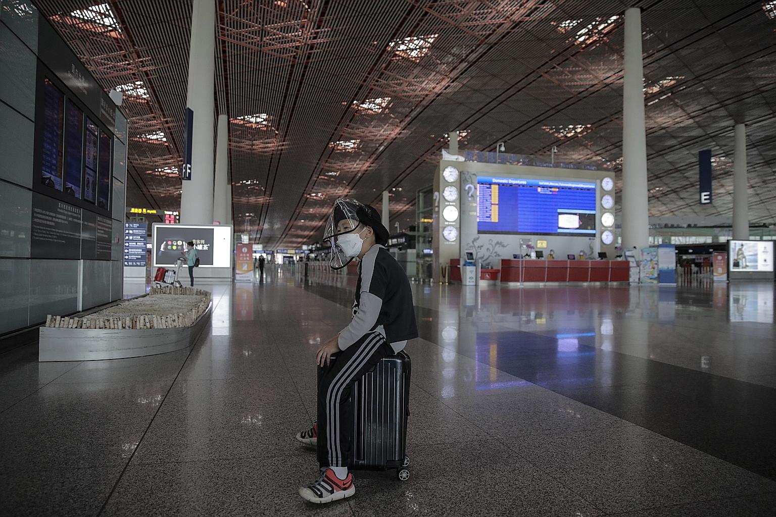 Volunteers disinfecting Yuegezhuang wholesale market in Beijing on Tuesday. The authorities ordered a disinfection and inspection of all wholesale markets, supermarkets and grocery stores after a market in Fengtai district was labelled a "hot spot". 