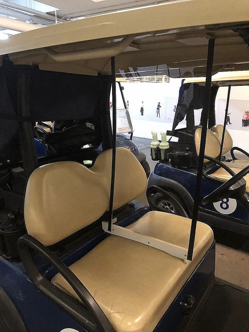 A man practising his golf swing at Gardens By The Bay East during the circuit breaker period. All golf clubs were closed since April 7 in line with the measures to curb the coronavirus pandemic. Below: Buggies at the Orchid Country Club have clear pl