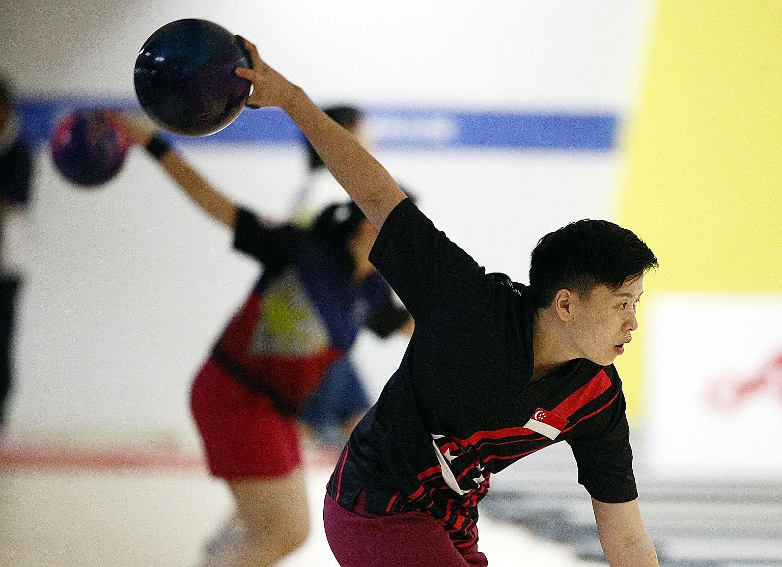 New Hui Fen is just glad to resume bowling although she will need to get used to wearing a mask on the lanes. ST FILE PHOTO