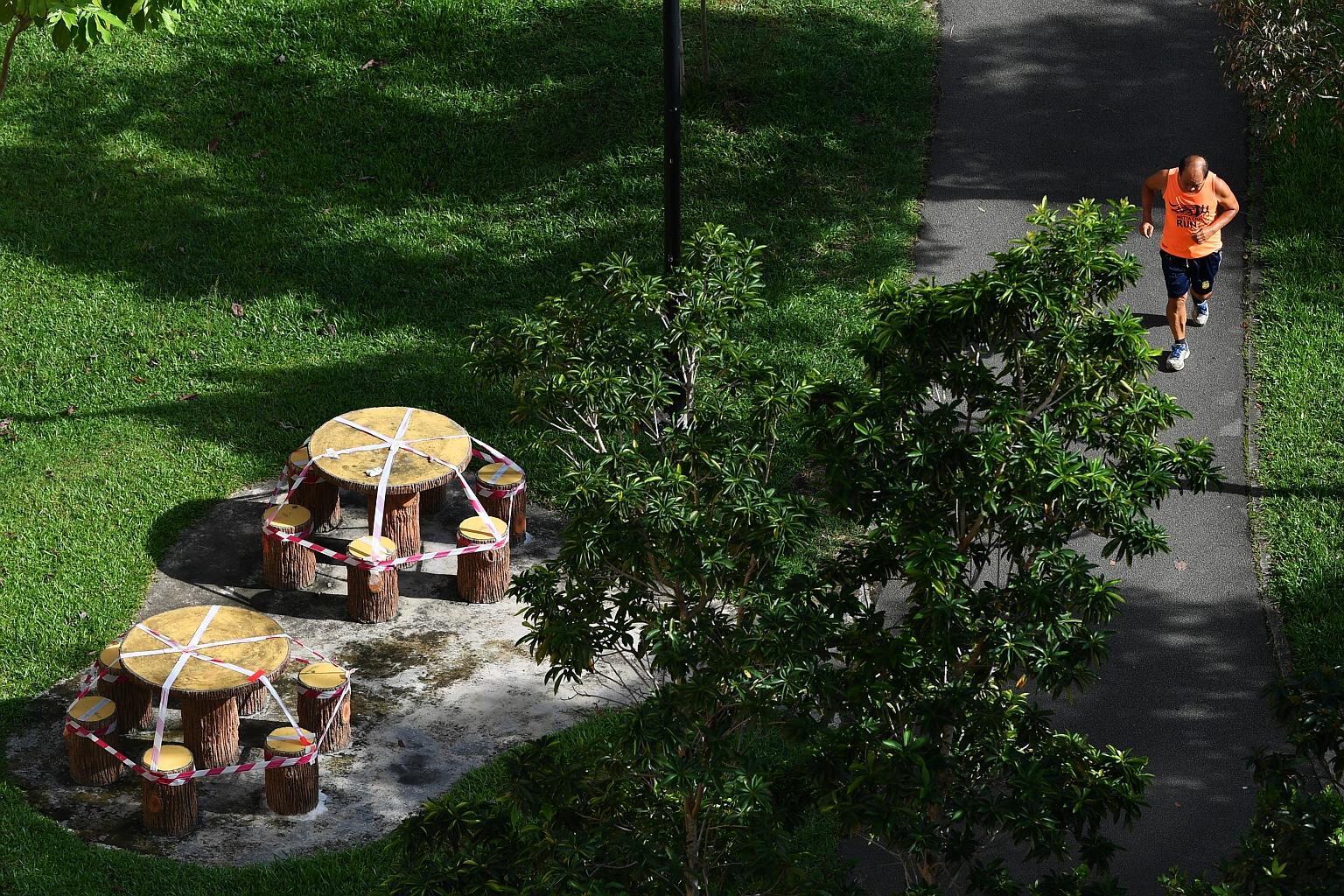 A jogger in Tampines Central Park yesterday. With 774 new cases discharged yesterday, 32,702 patients have fully recovered from the disease. ST PHOTO: LIM YAOHUI