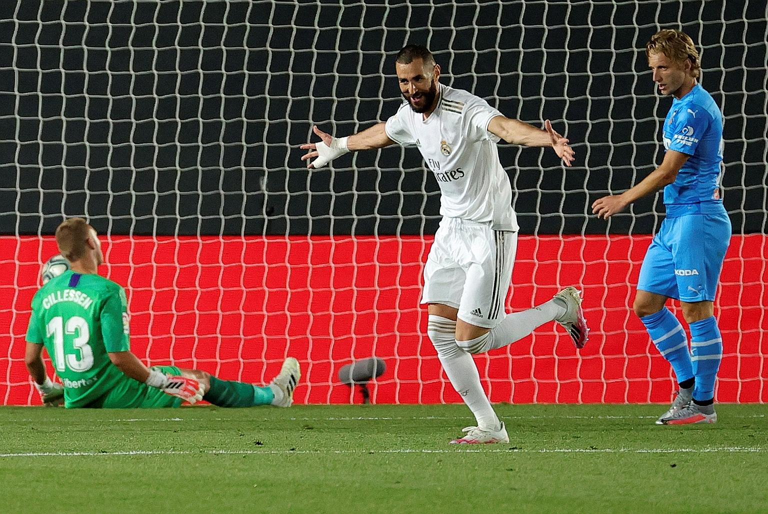 An ecstatic Real Madrid striker Karim Benzema after scoring the wonder third goal during the La Liga match against Valencia at Alfredo di Stefano Stadium in Madrid on Thursday. Benzema gave Real the lead, and his brace took his season's tally to 21 goals 