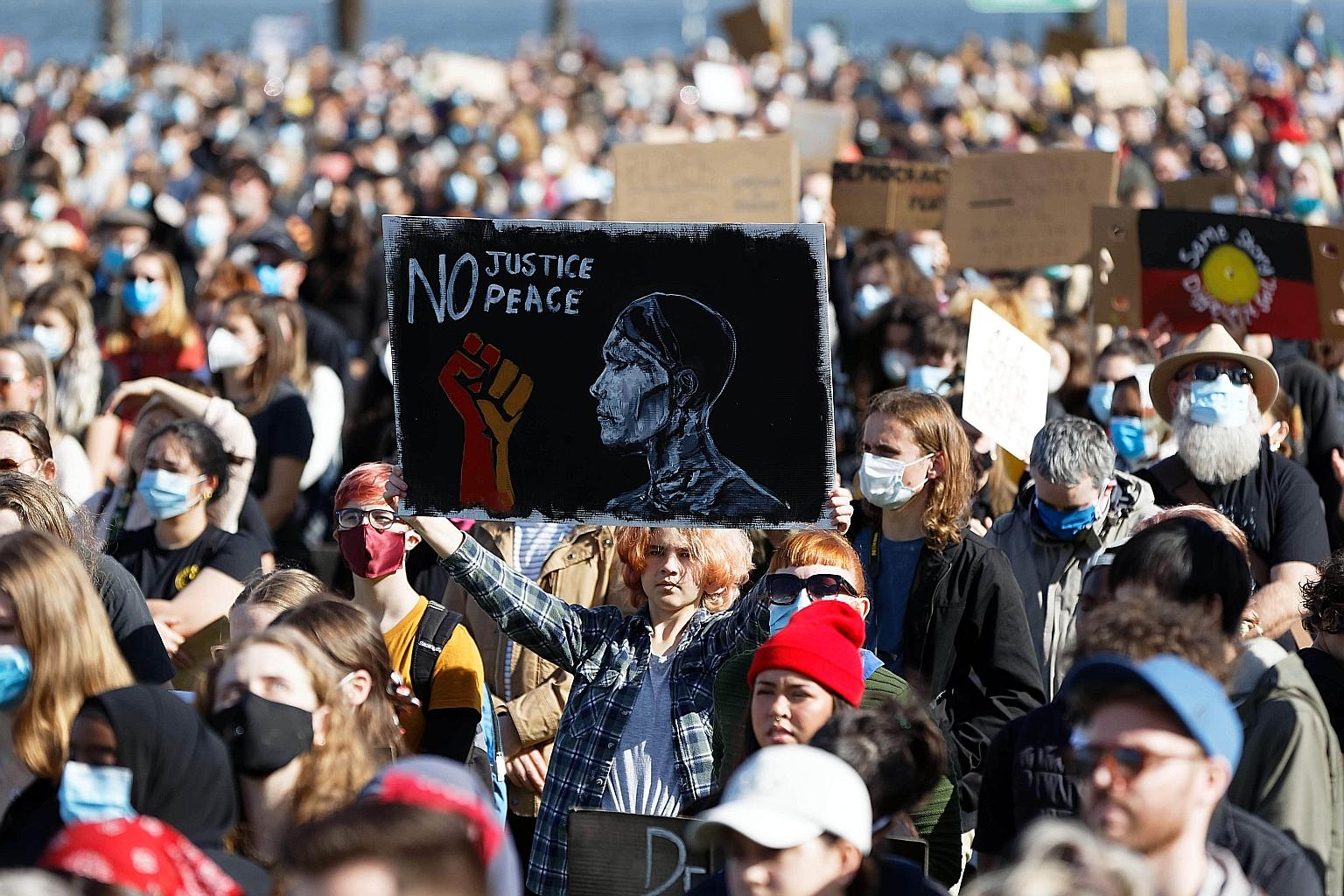Demonstrators at a Black Lives Matter protest last week in Perth, Australia, in solidarity with US protesters. They were also demanding an end to Aboriginal deaths in custody. PHOTO: AGENCE FRANCE-PRESSE