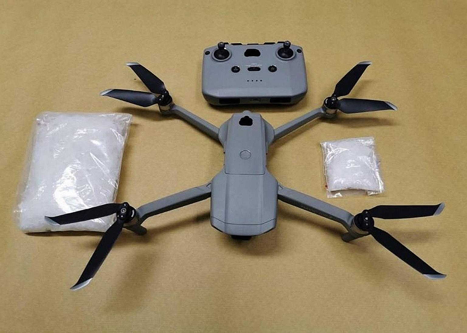 A drone and drugs seized by the Central Narcotics Bureau last Wednesday, as part of operations that saw four Singaporeans arrested for suspected drug activities. The total value of the drugs seized was at least $44,000. PHOTO: CENTRAL NARCOTICS BUREA