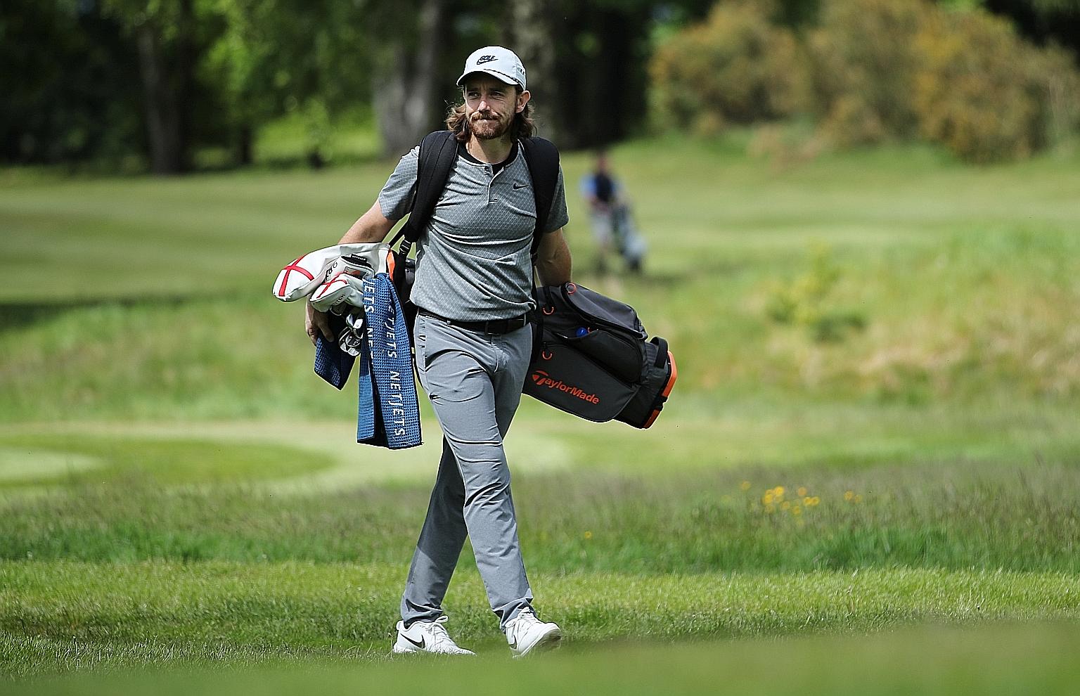 Tommy Fleetwood carrying his own clubs at Sandiway Golf Club in Northwich, Cheshire last month. The English golfer, who dropped out of the world's top 10 after missing the Tour's restart, will resume his season only at the end of next month at the St