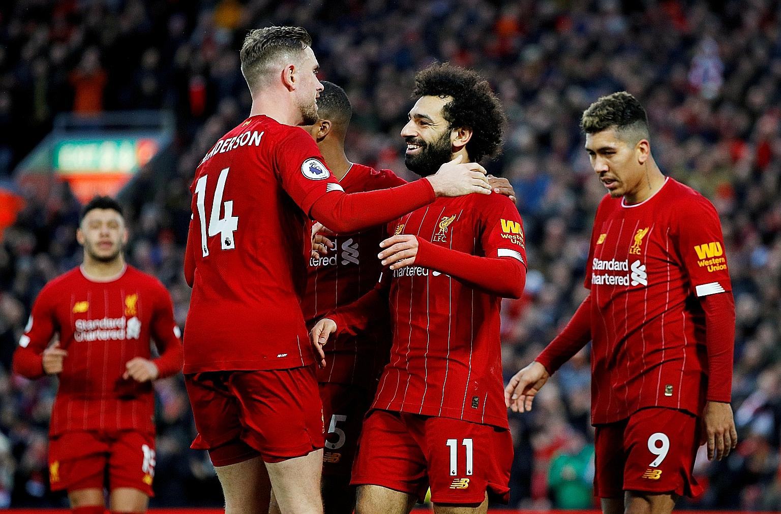 Liverpool’s Mohamed Salah (above, centre) celebrates with teammates after scoring a goal against Southampton on Feb 1.