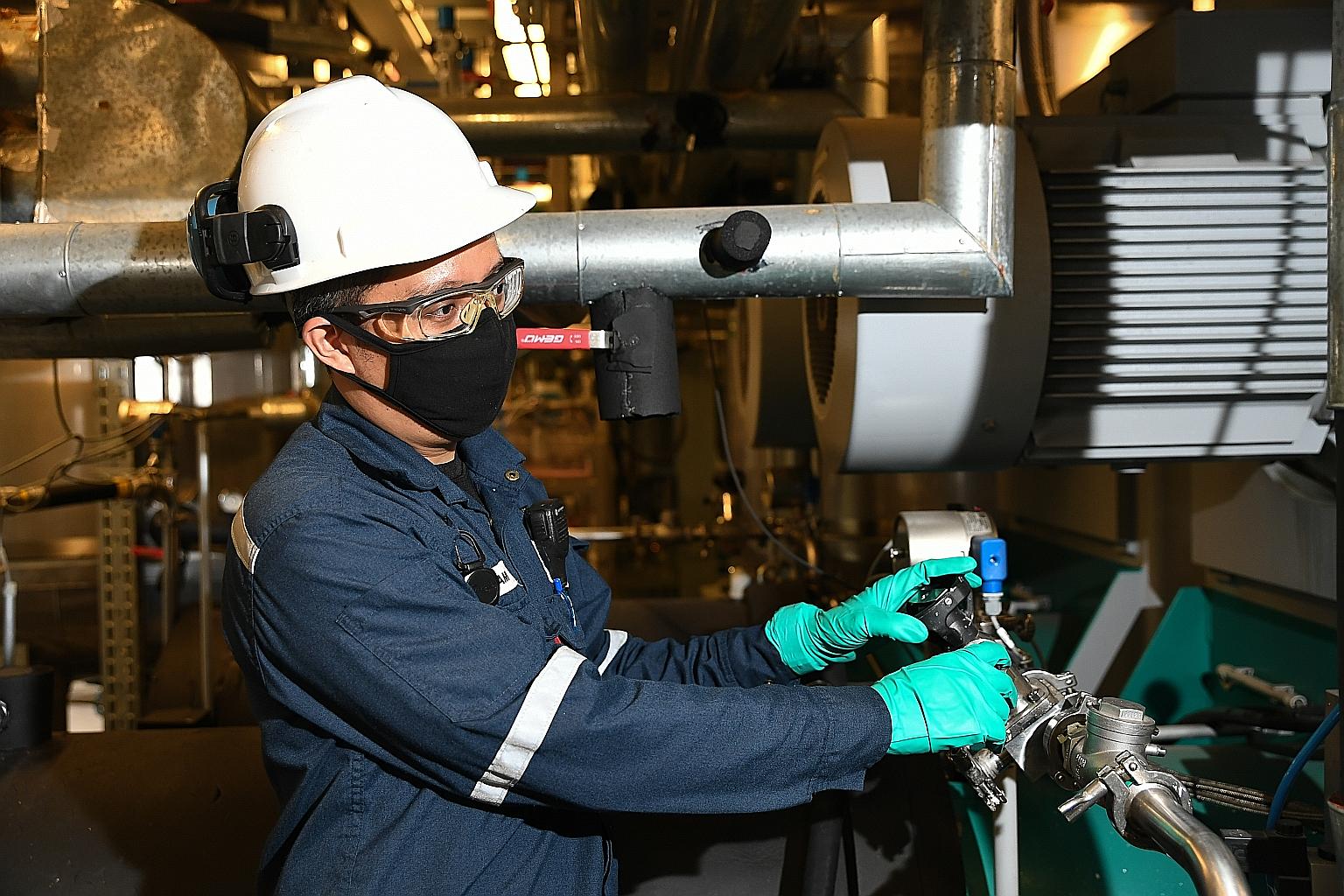 Process technician Hisham Samat using a milling machine at the Syngenta Asia Pacific formulation plant. The plant can turn out an average of 40 tons of liquid crop protection products a week and produces enough over a year to benefit a million hectares of