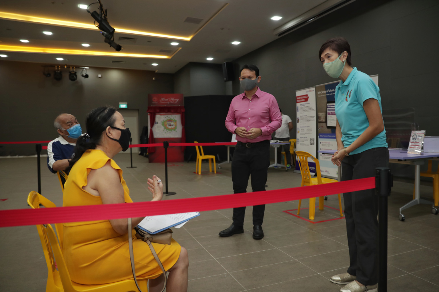 Manpower Minister Josephine Teo and Minister of State for Manpower Zaqy Mohamad speaking to job seeker Linda Chen, 60, at the SGUnited Jobs and Skills Centre at Keat Hong Community Club yesterday. ST PHOTO: GIN TAY
