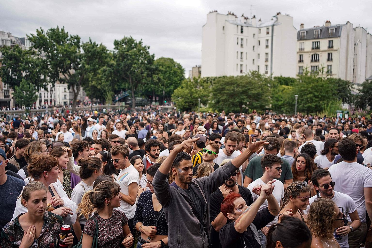 People dancing at the French midsummer Festival of Music at the Villemin garden in Paris on Sunday. But many who watched the crowds on the streets were horrified, taking to social media to voice fears of a second wave of coronavirus infections and cr