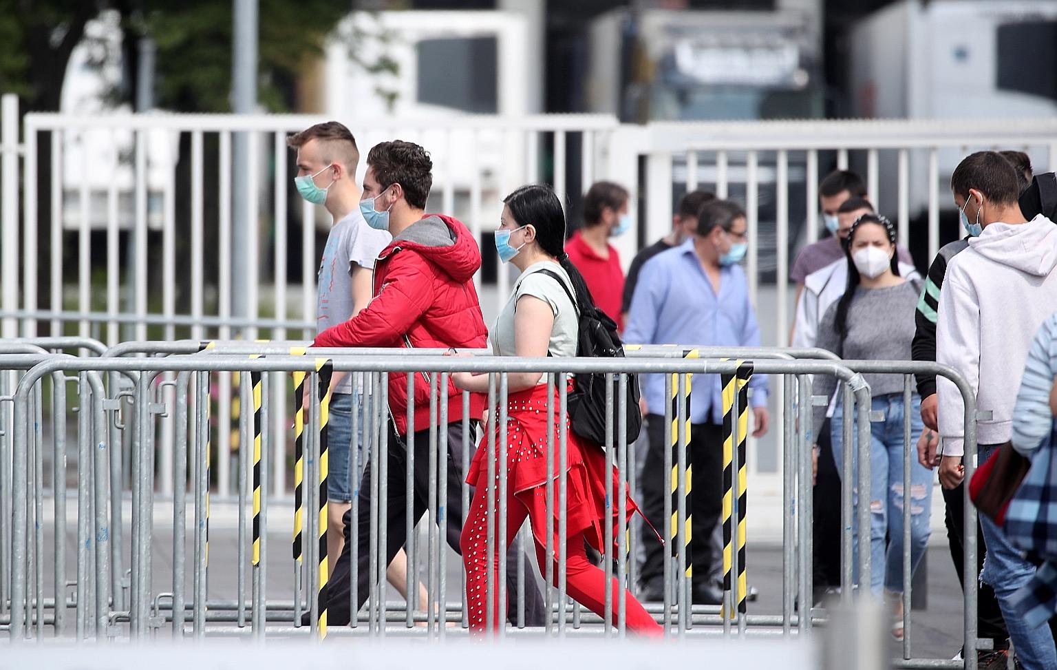 Employees of the meat processing company Toennies at the headquarters in Rheda-Wiedenbrueck, western Germany, last Friday. The country's recent coronavirus outbreaks have occurred in places such as meat processing plants. PHOTO: EPA-EFE