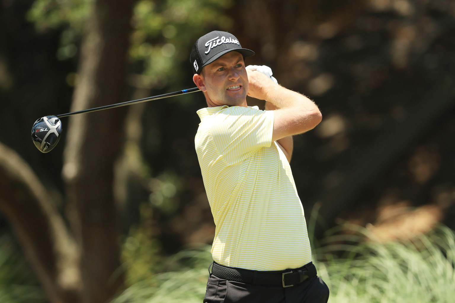 Webb Simpson playing his shot from the second tee in the final round of the RBC Heritage on Sunday at Harbour Town Golf Links. He came from behind on the back nine and made five birdies over his final seven holes to win by a stroke. PHOTO: AGENCE FRA