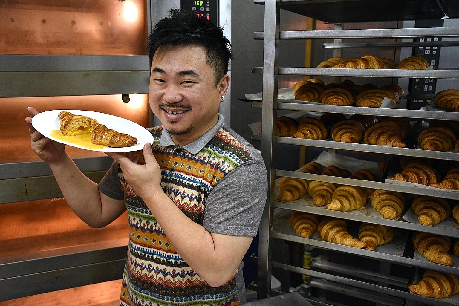 A photo taken in February 2016 of Antoinette's chef-owner Pang Kok Keong with one of his salted egg yolk croissants.
