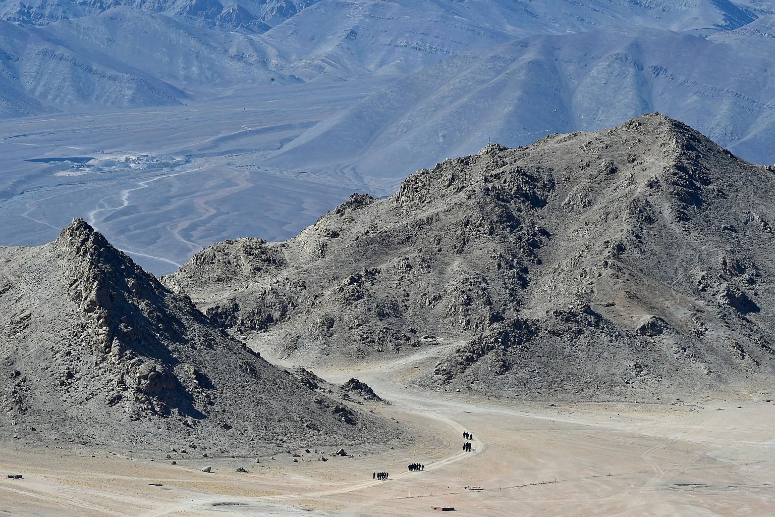 Indian soldiers in the foothills of a mountain range near Leh yesterday. Indian and Chinese forces clashed in the Galwan Valley on June 15, killing 20 Indian soldiers in the worst border flare-up in over four decades. China has not given any informat