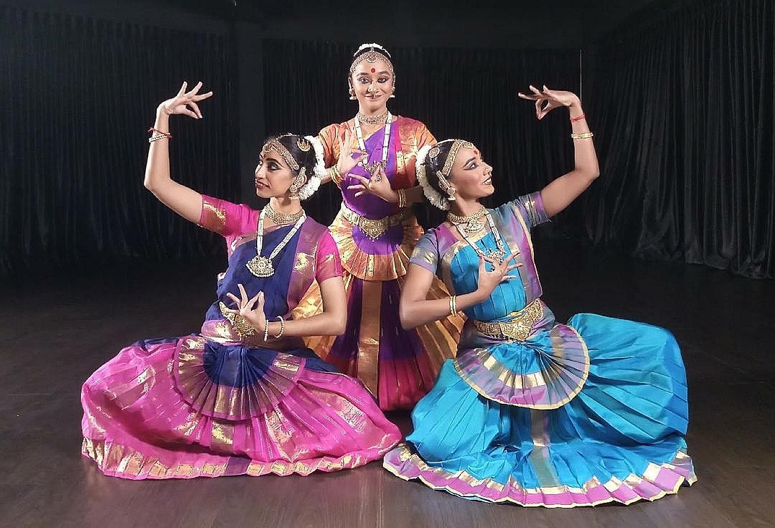 Dancers (from left) Priyadarshini Nagarajah, Davinya Ramathas and Sarenniya Ramathas perform Prati Sandhi (Reunion), which is inspired by the classic Hindu scripture, the Bhagavad Gita.
