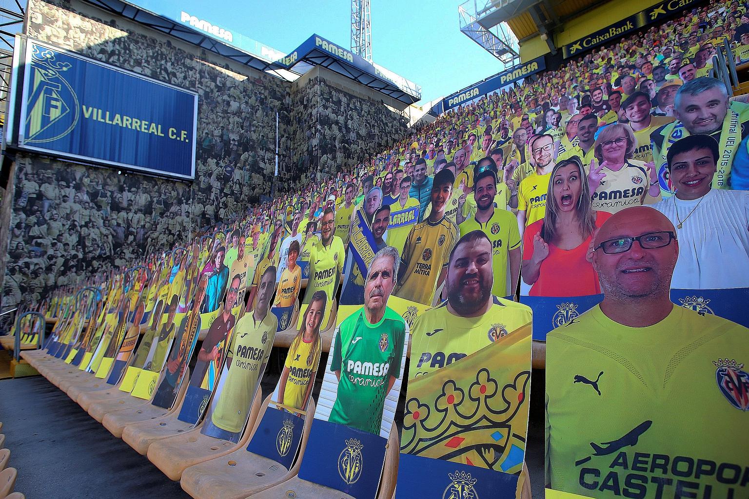 Cardboard cut-outs, like these at Monday's La Liga game between Villarreal and Sevilla, could make way for a limited number of fans before the season ends. PHOTO: EPA-EFE